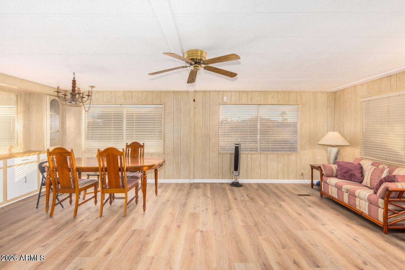 5546 East Player Place Mesa, AZ 85215 - Photo 2 of 8 a living room with furniture and wooden floor