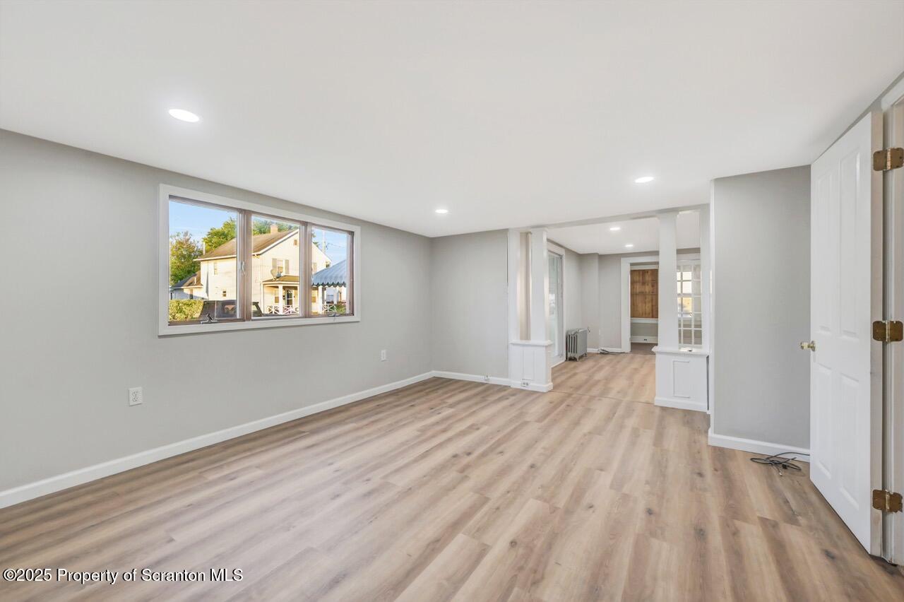 201 Jackson Street Olyphant, PA 18447 - Photo 19 of 70 a view of empty room with wooden floor and fan