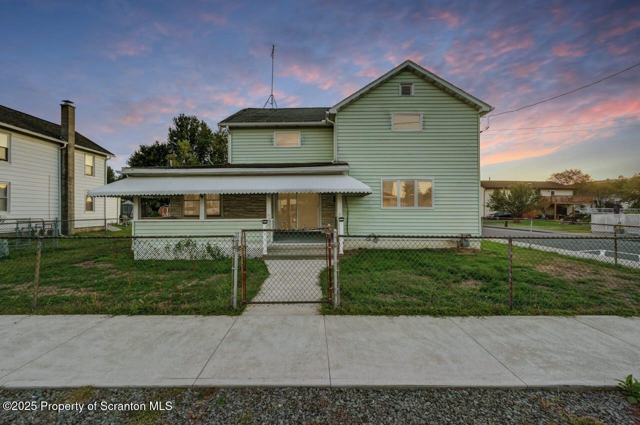 201 Jackson Street Olyphant, PA 18447 - Photo 2 of 70 a front view of a house with a yard