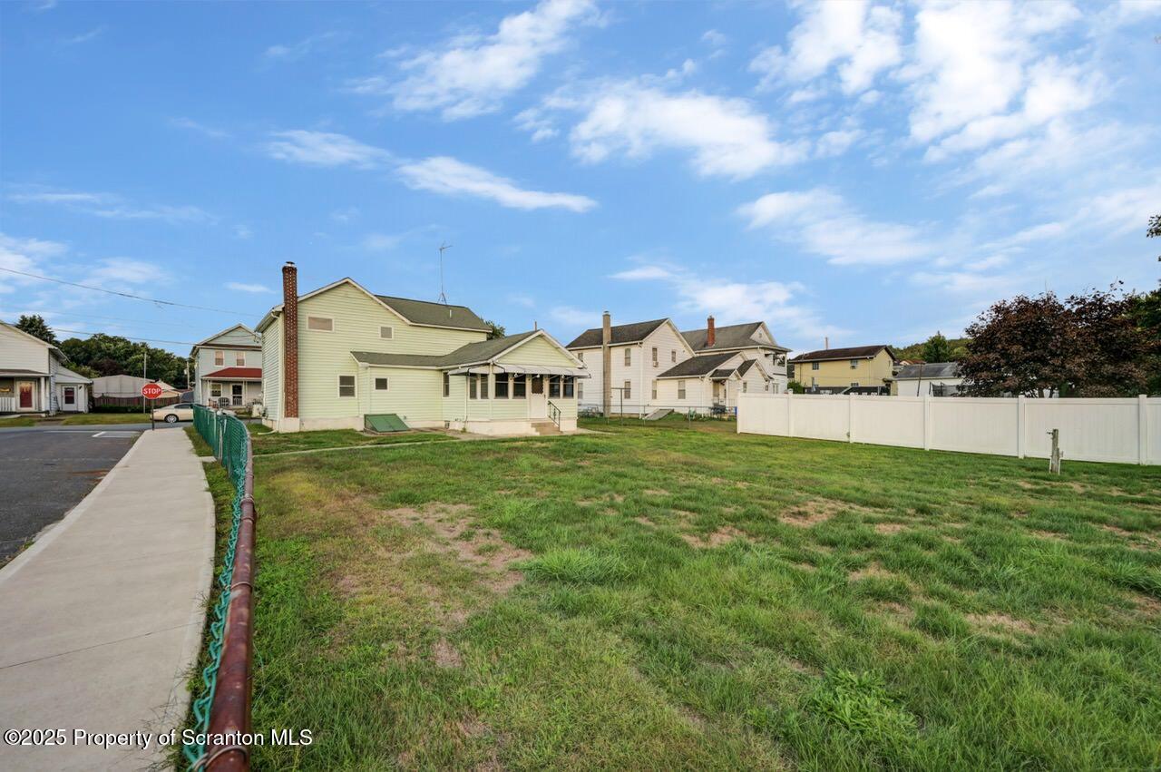 201 Jackson Street Olyphant, PA 18447 - Photo 3 of 70 a view of a street with houses