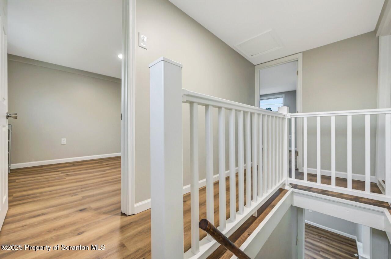 201 Jackson Street Olyphant, PA 18447 - Photo 34 of 70 a view of a hallway with wooden floor and staircase