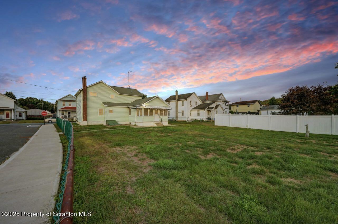 201 Jackson Street Olyphant, PA 18447 - Photo 4 of 70 a view of a street with a building in the background
