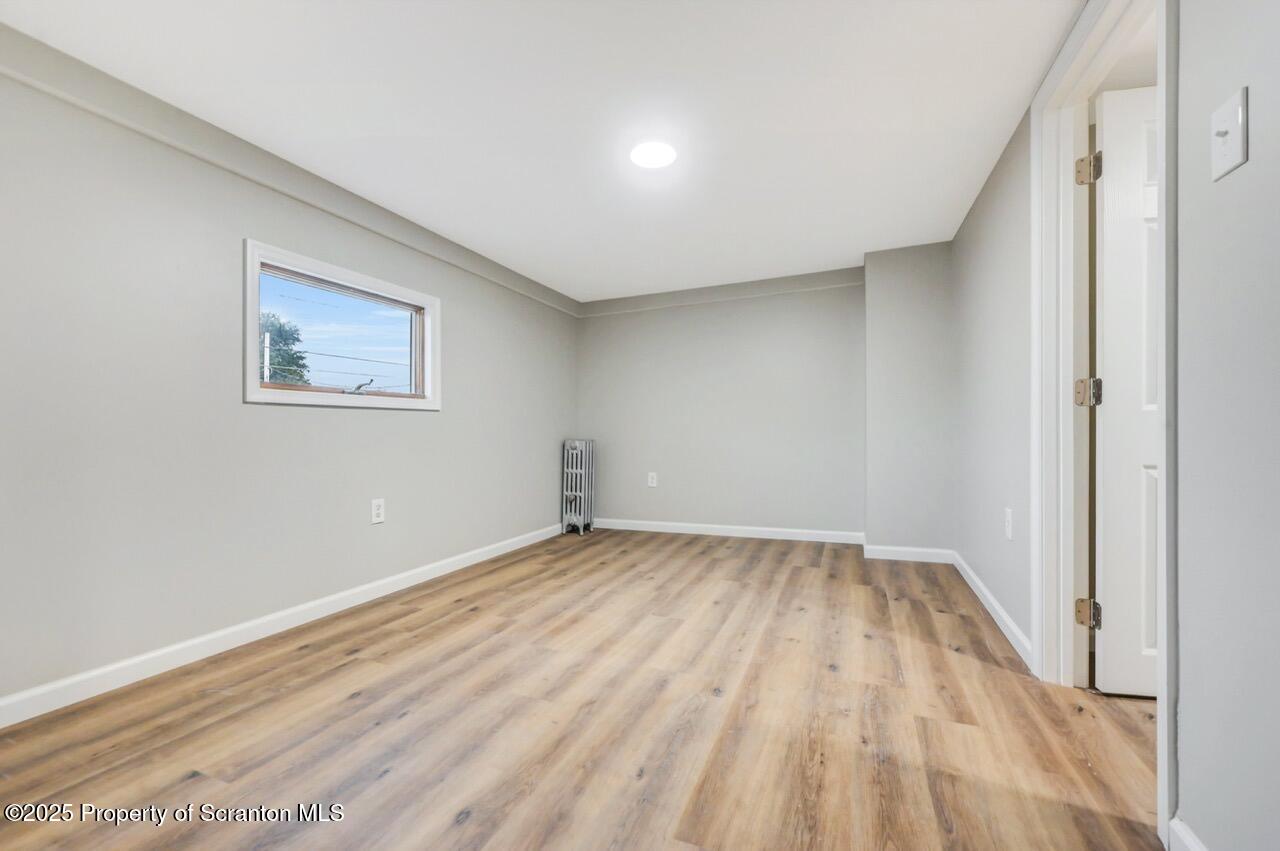 201 Jackson Street Olyphant, PA 18447 - Photo 43 of 70 a view of an empty room and wooden floor