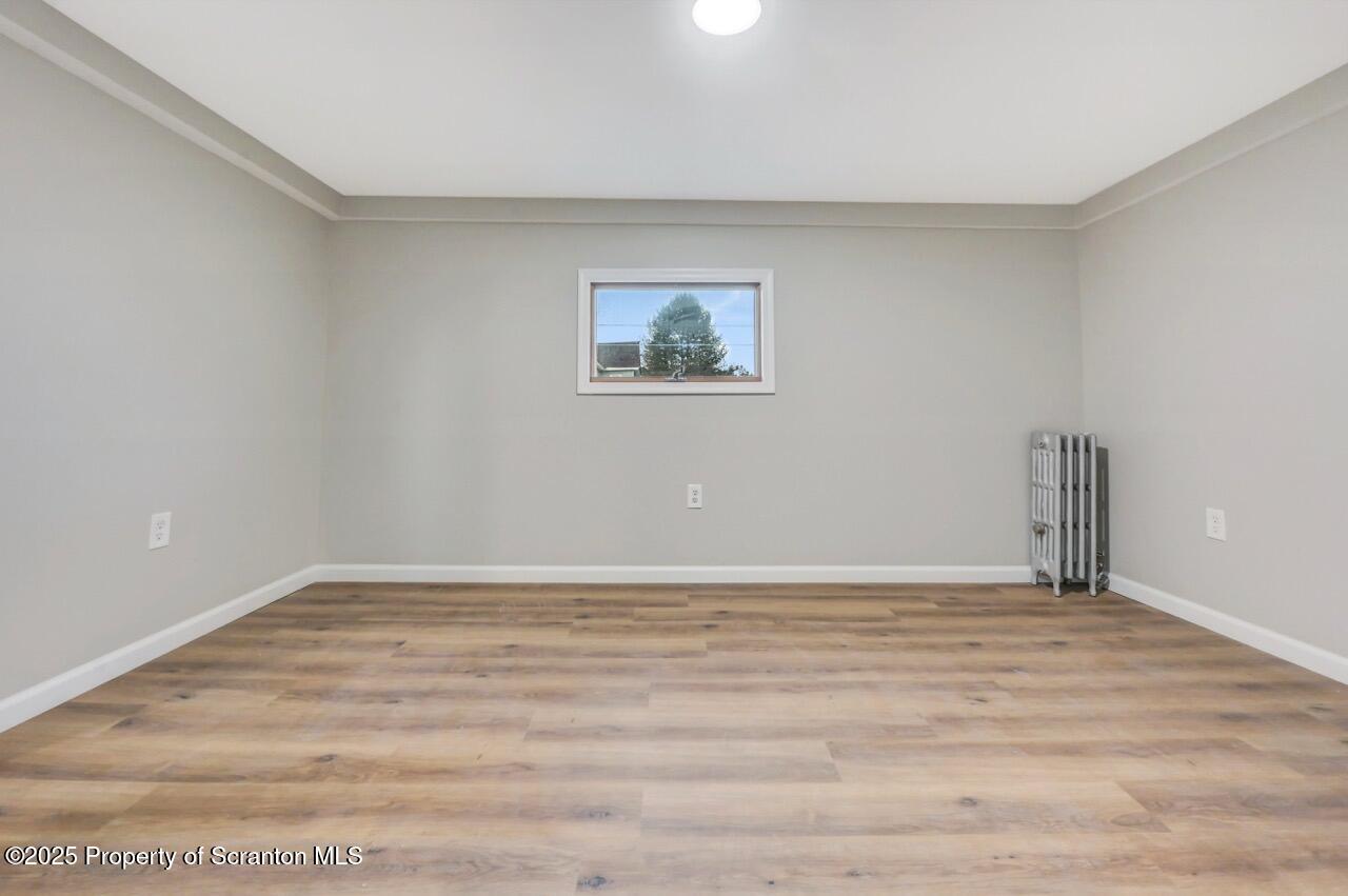 201 Jackson Street Olyphant, PA 18447 - Photo 46 of 70 a view of an empty room with wooden floor
