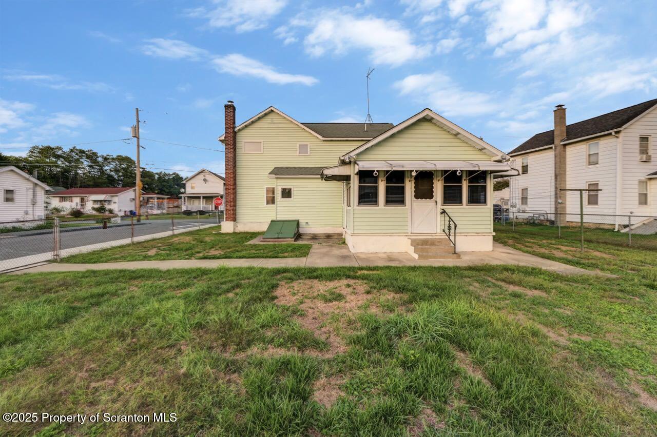 201 Jackson Street Olyphant, PA 18447 - Photo 5 of 70 a front view of a house with a yard
