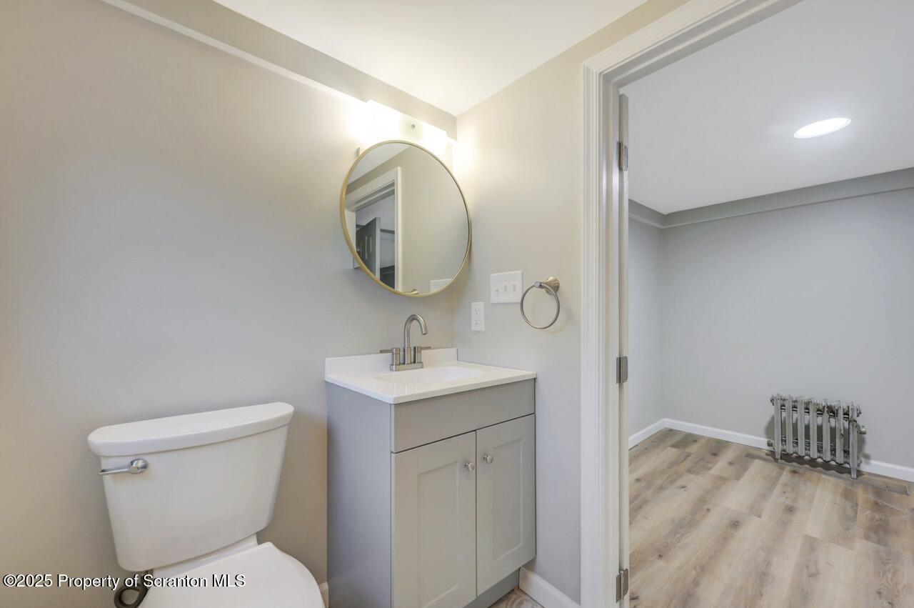 201 Jackson Street Olyphant, PA 18447 - Photo 52 of 70 a bathroom with a toilet a sink and mirror