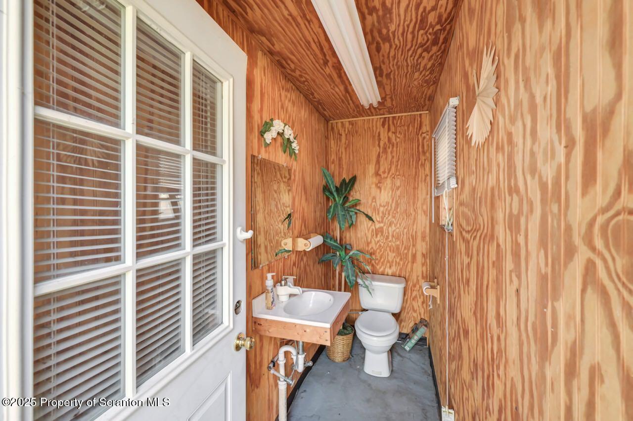 201 Jackson Street Olyphant, PA 18447 - Photo 58 of 70 a balcony with a bench and a shower curtain