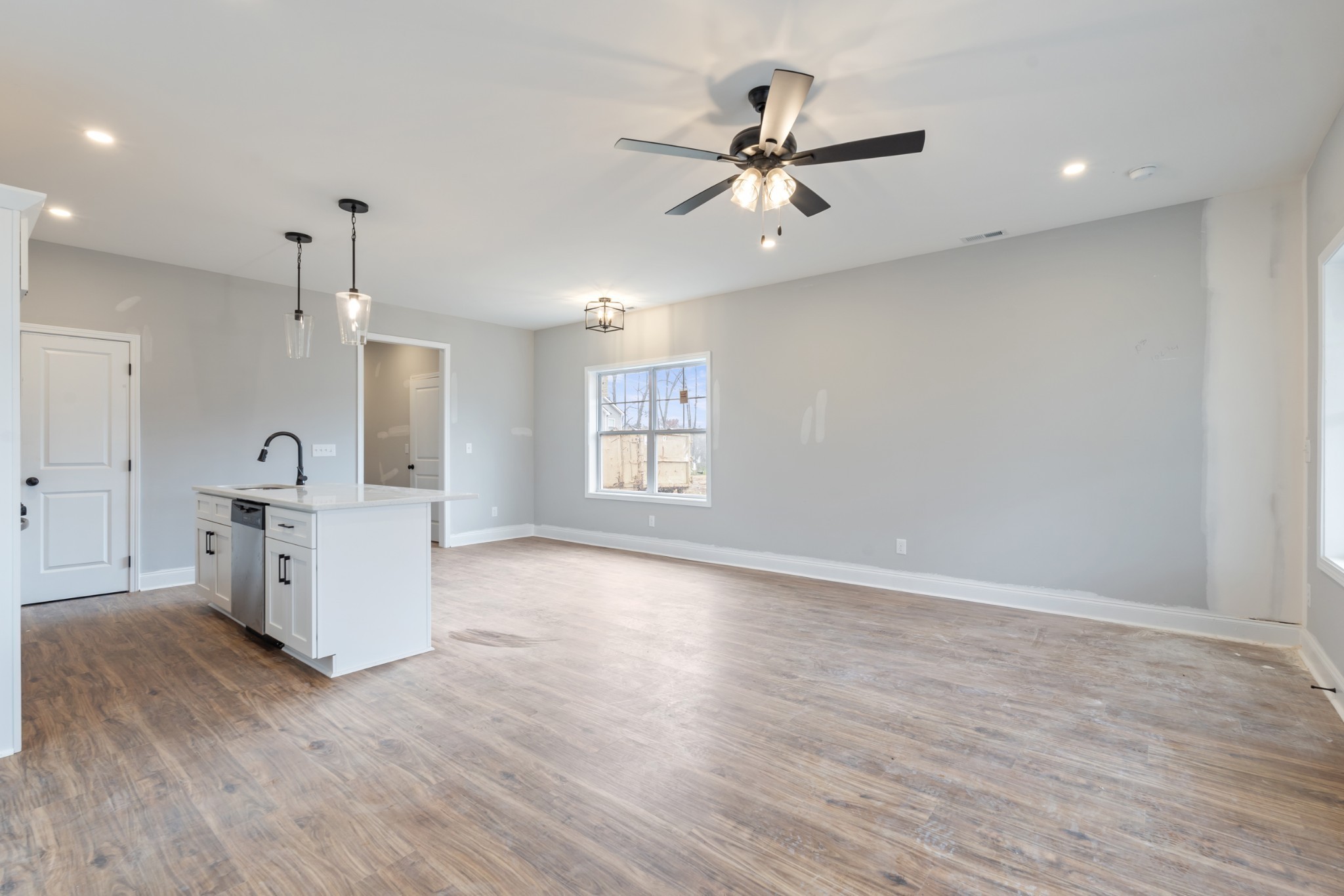 87 Charlotte Road Clarksville, TN 37040 - Photo 11 of 26 a view of a kitchen with wooden floor and window