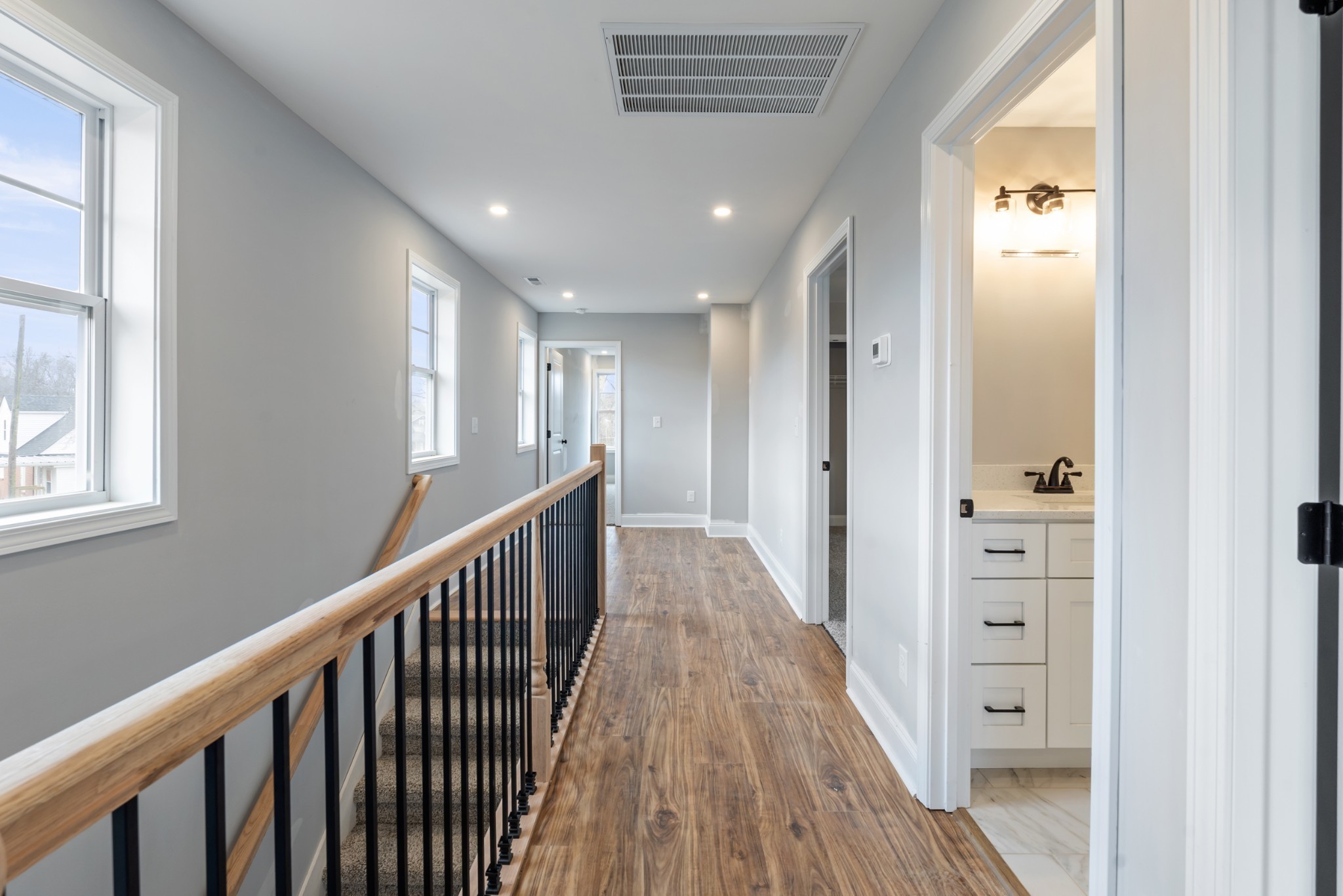 87 Charlotte Road Clarksville, TN 37040 - Photo 19 of 26 a view of a hallway with wooden floor and windows