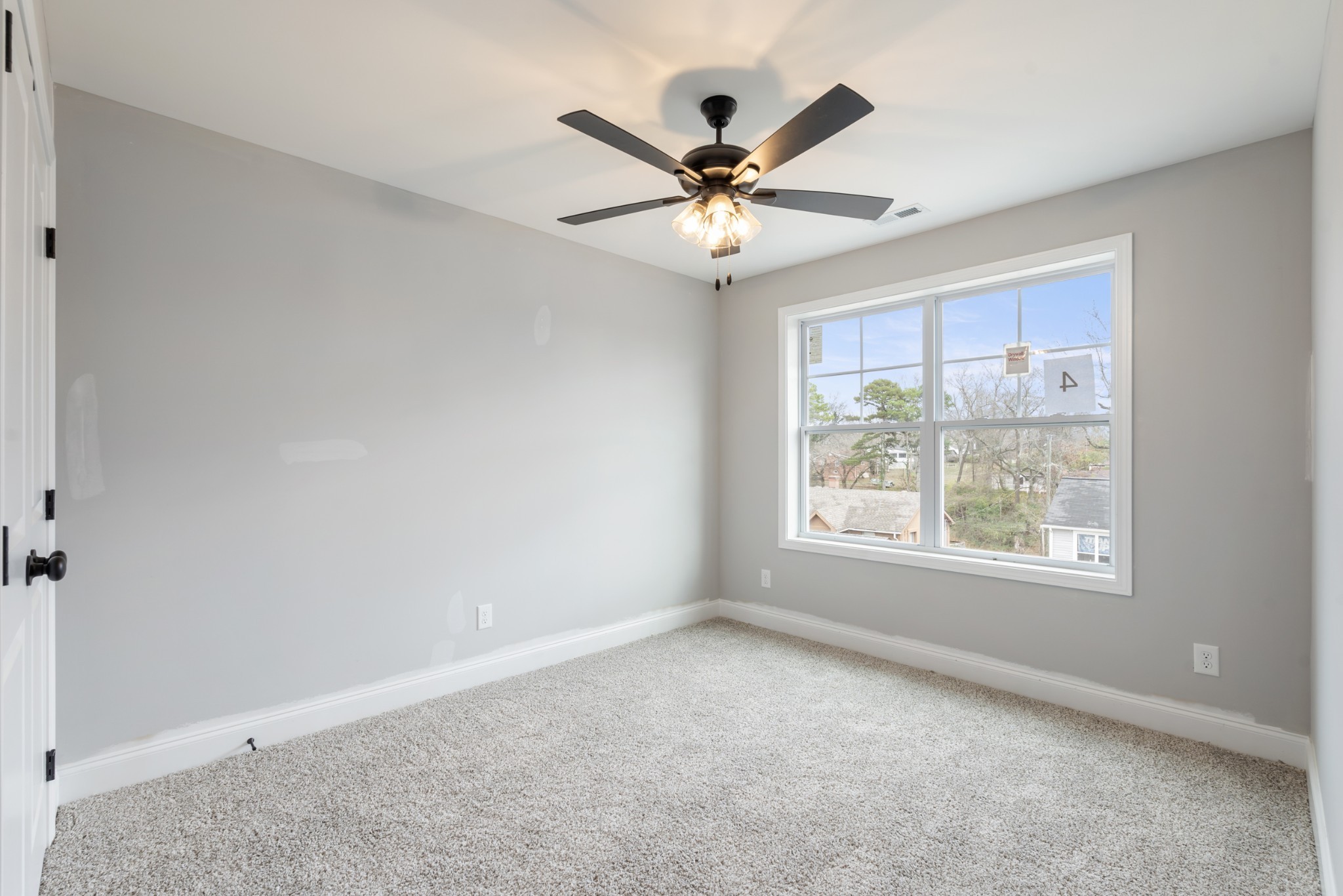 87 Charlotte Road Clarksville, TN 37040 - Photo 20 of 26 a view of a livingroom with a ceiling fan and window