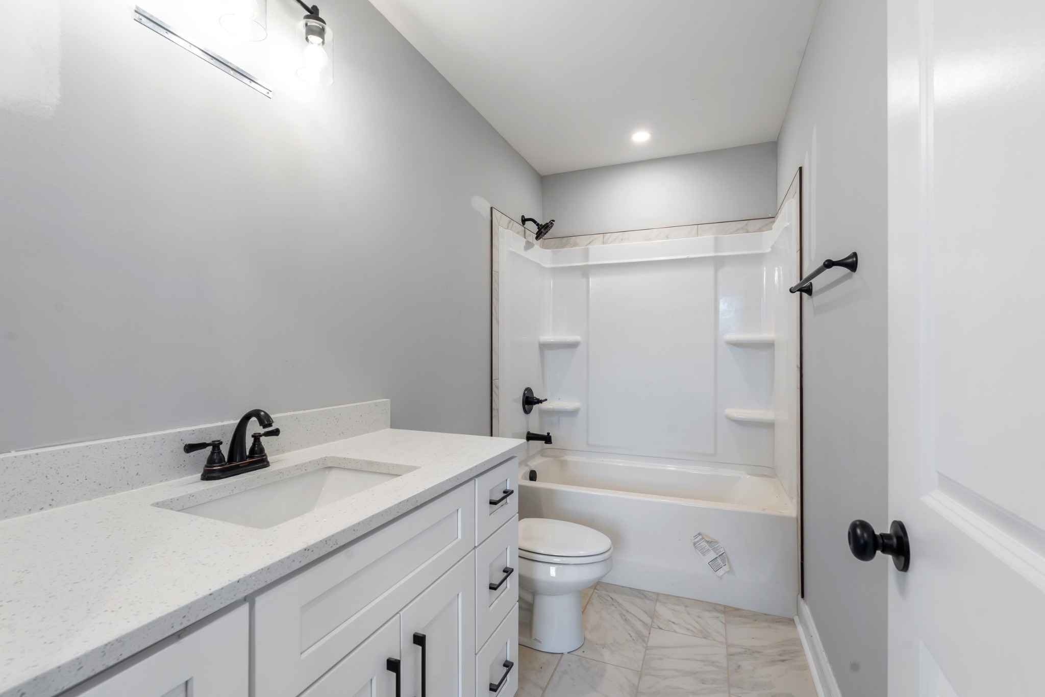 87 Charlotte Road Clarksville, TN 37040 - Photo 21 of 26 a bathroom with a sink a toilet and shower
