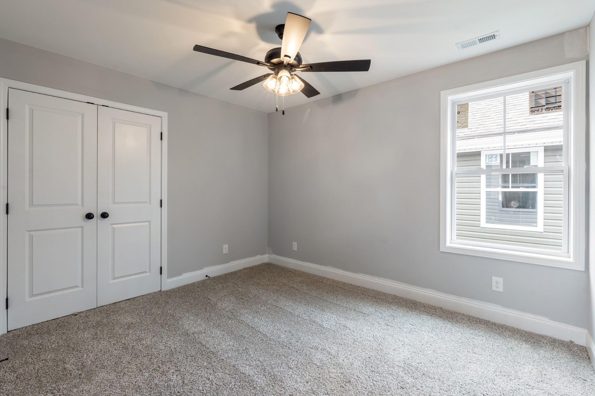 87 Charlotte Road Clarksville, TN 37040 - Photo 22 of 26 a view of a livingroom with a ceiling fan and window