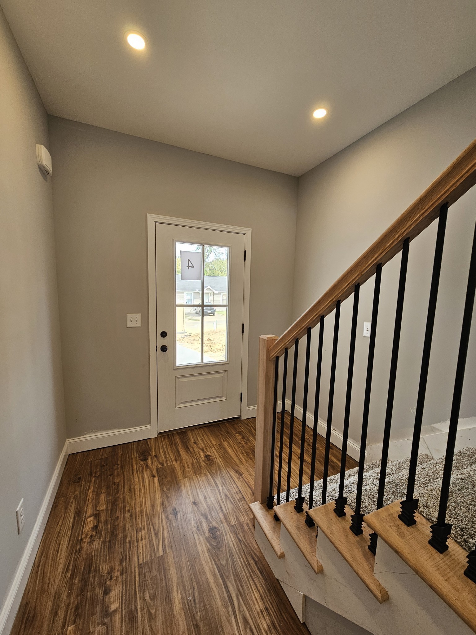 87 Charlotte Road Clarksville, TN 37040 - Photo 3 of 26 a view of an empty room with wooden floor and staircase