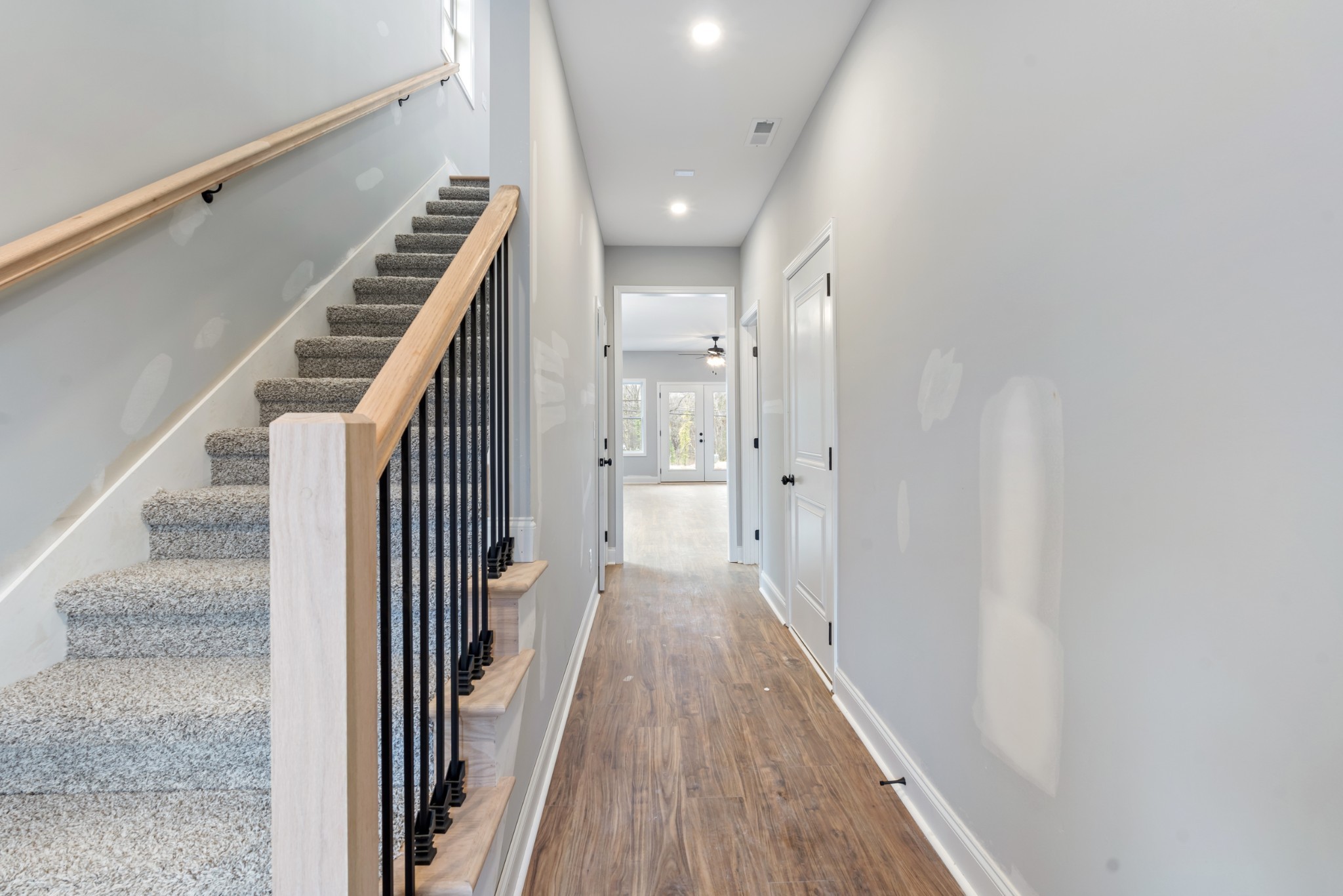 87 Charlotte Road Clarksville, TN 37040 - Photo 5 of 26 a view of a hallway with wooden floor and staircase