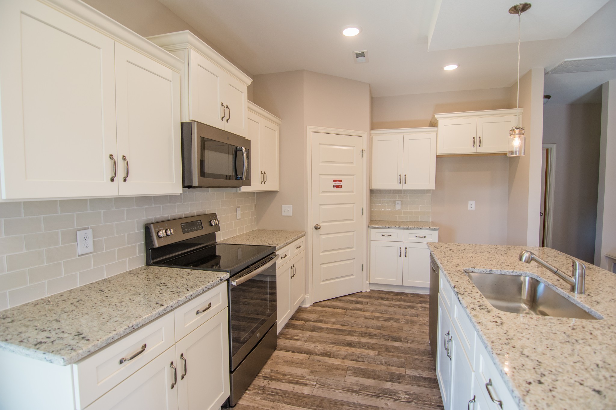223 Cherry Fields Clarksville, TN 37042 - Photo 5 of 8 a kitchen with granite countertop a sink stove and refrigerator