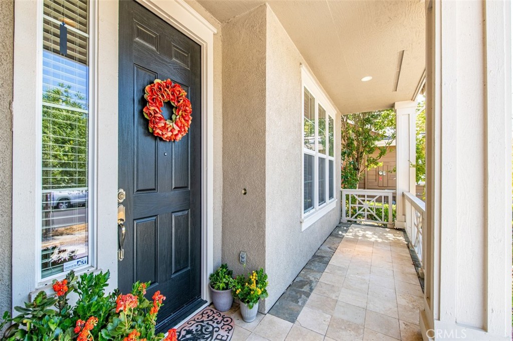 a view of an entryway with wooden floor