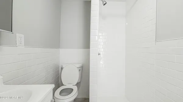 a bathroom with a toilet and a sink
