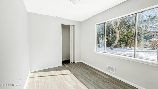 a view of a room that has a window in it