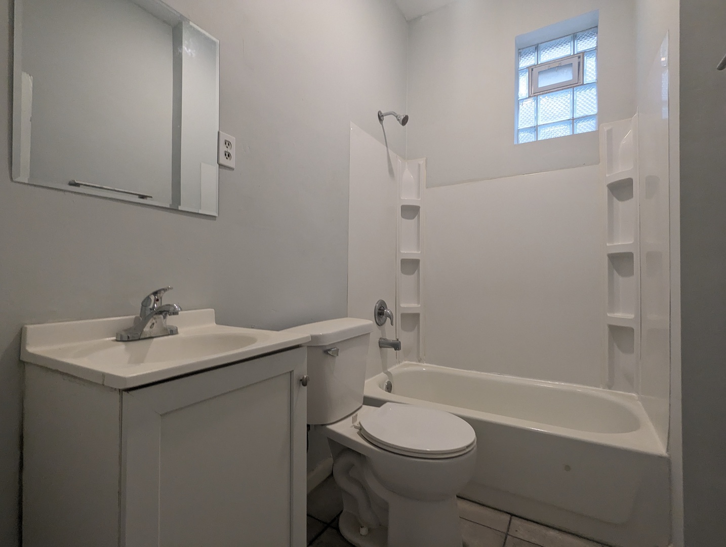 3544 North Halsted Street, Unit 3F Chicago, IL 60657 - Photo 15 of 28 a bathroom with a sink toilet and shower