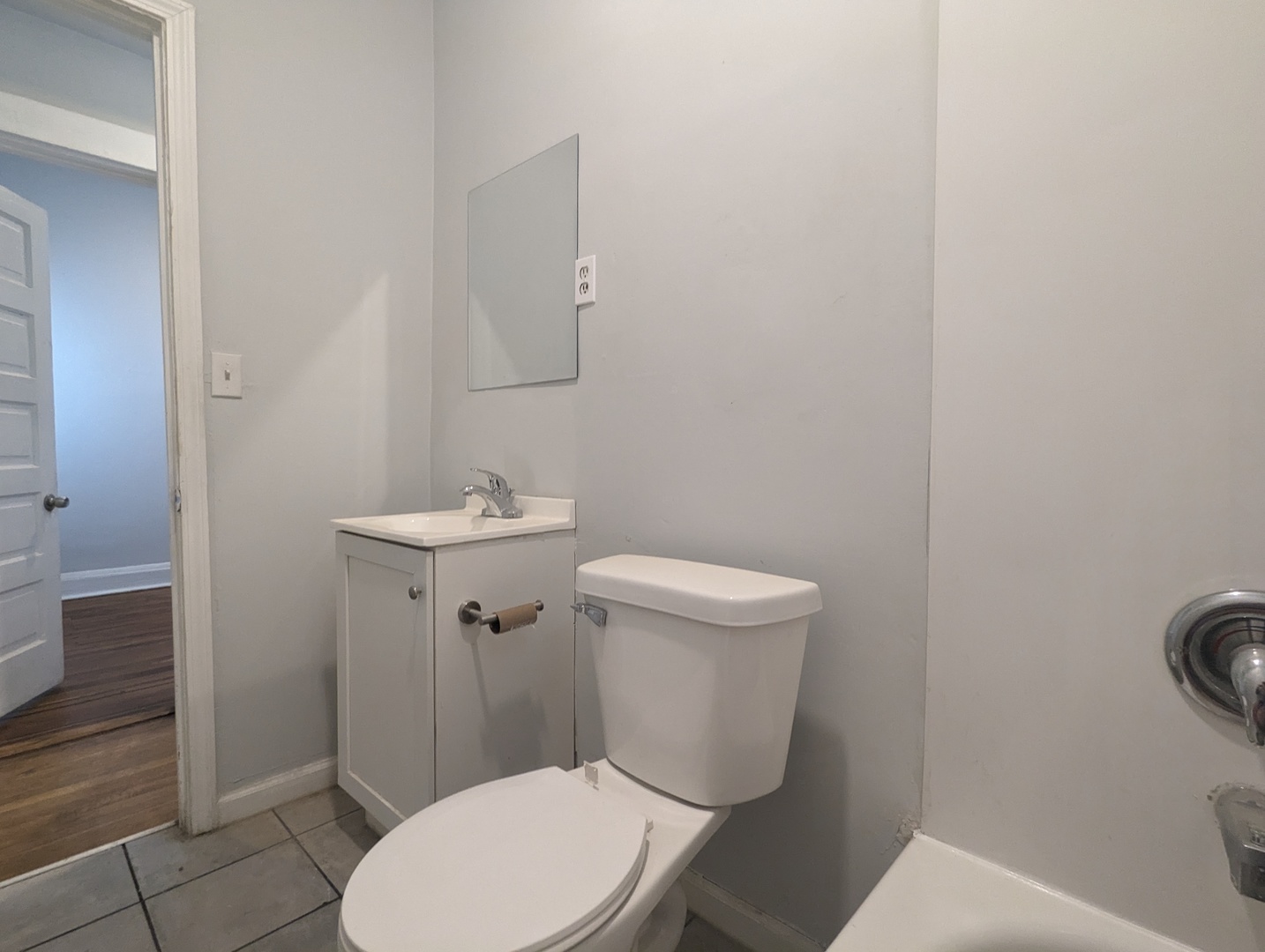 3544 North Halsted Street, Unit 3F Chicago, IL 60657 - Photo 16 of 28 a white toilet sitting next to a bathroom sink