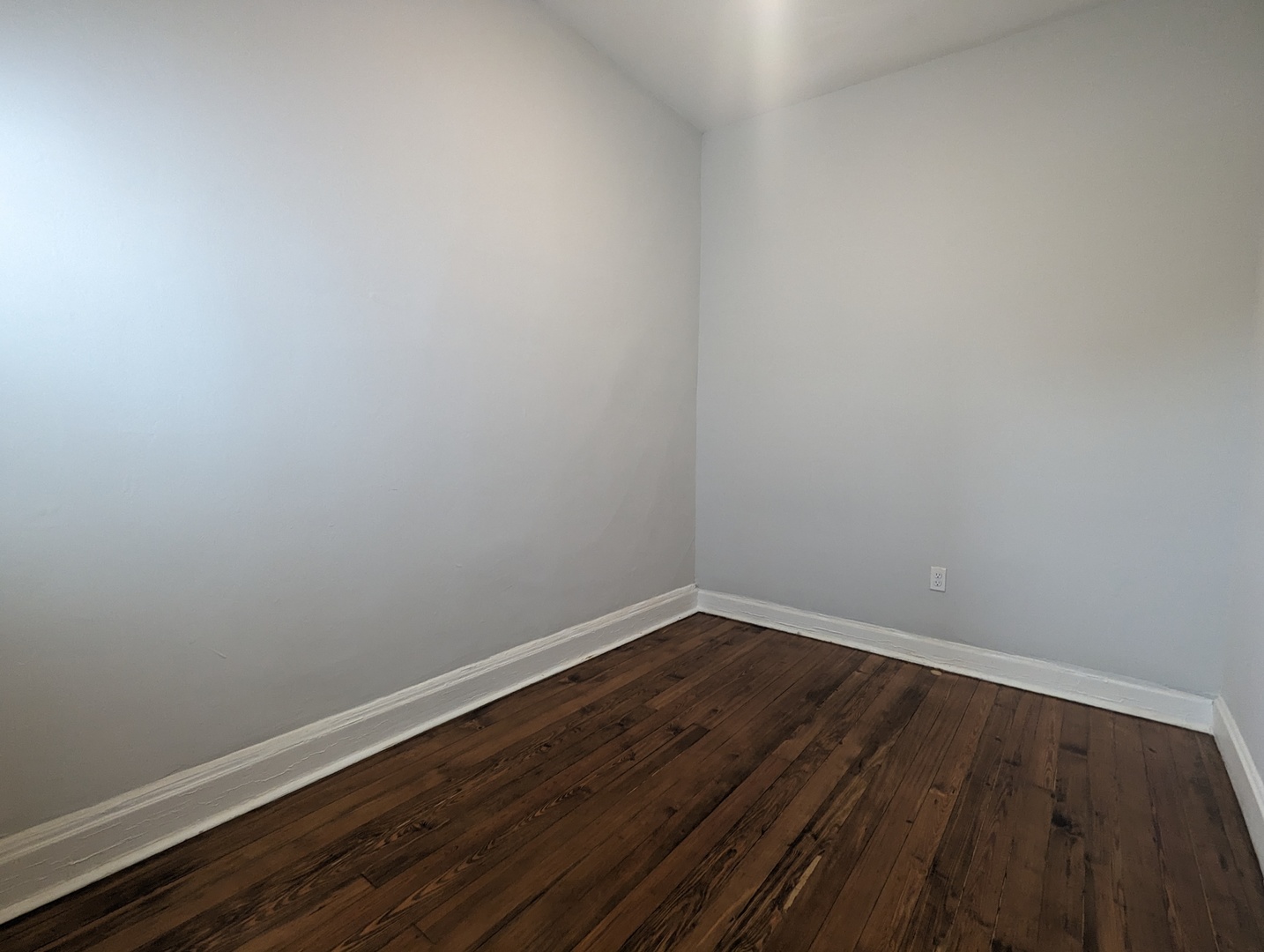 3544 North Halsted Street, Unit 3F Chicago, IL 60657 - Photo 20 of 28 a view of an empty room with wooden floor