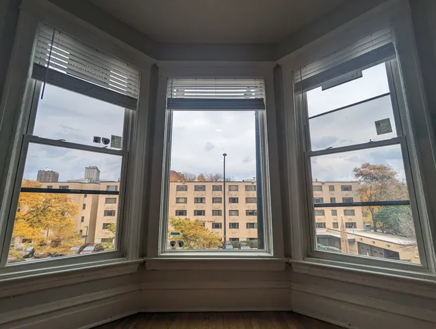 a view of an empty room with a window
