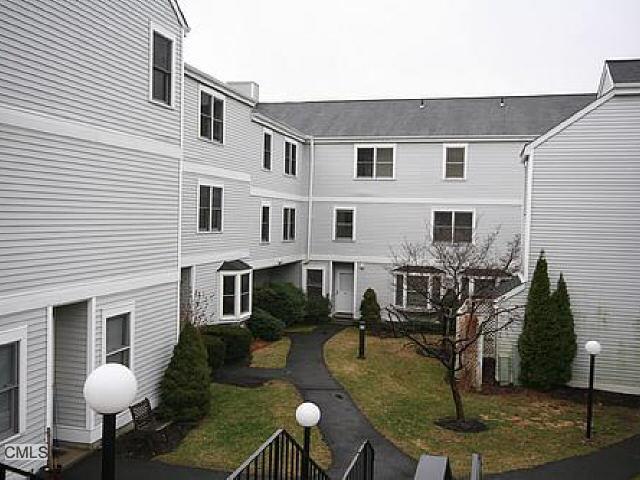 55 Mill Plain Road, Unit 324 Danbury, CT 06811 - Photo 1 of 1 a view of a house with backyard and sitting area