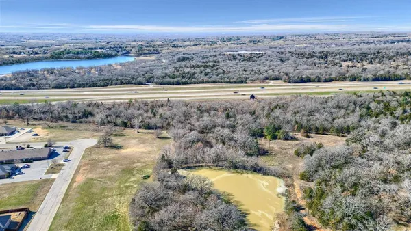 a view of a lake with a yard