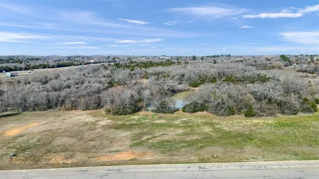 a view of a field with an ocean