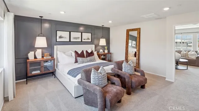 a bedroom with furniture and a window