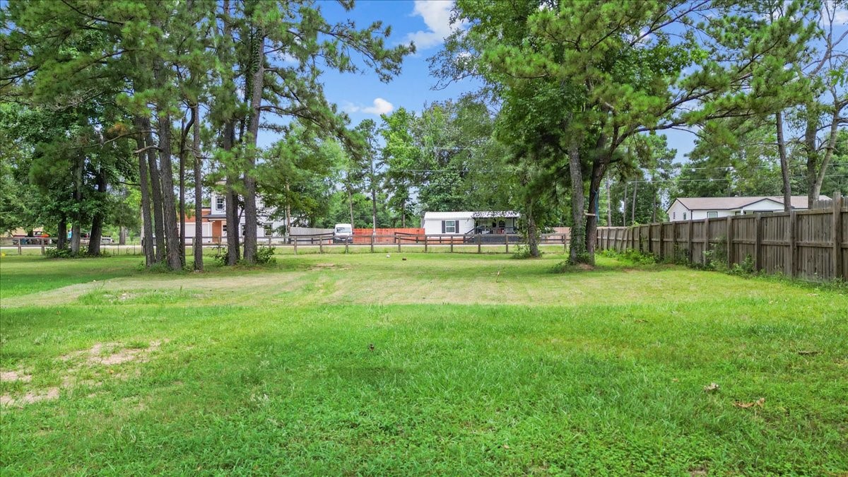 21658 County Road 3749D Cleveland, TX 77327 - Photo 13 of 26 a view of a park with large trees