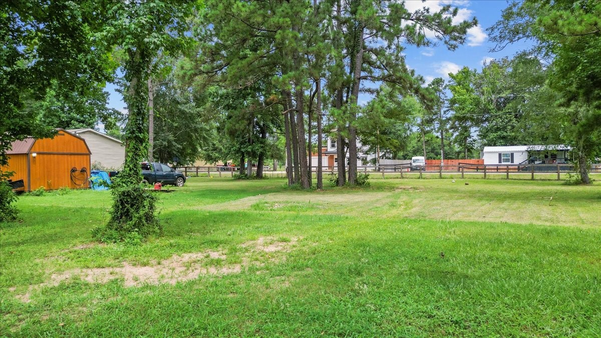 21658 County Road 3749D Cleveland, TX 77327 - Photo 15 of 26 a view of a park with trees and grass