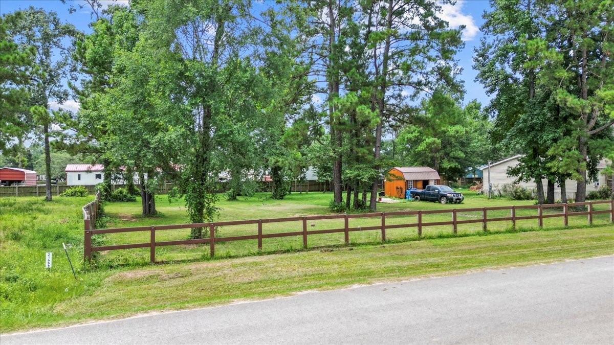 21658 County Road 3749D Cleveland, TX 77327 - Photo 17 of 26 a view of a park with large trees
