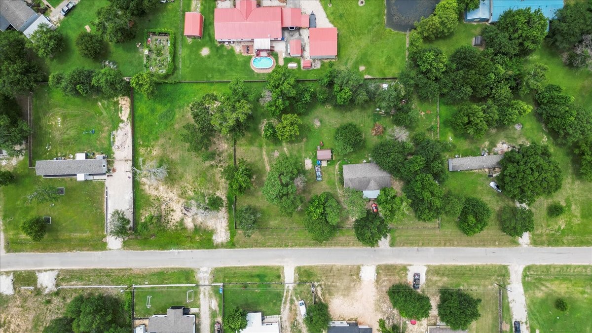 21658 County Road 3749D Cleveland, TX 77327 - Photo 19 of 26 a view of a garden from a window