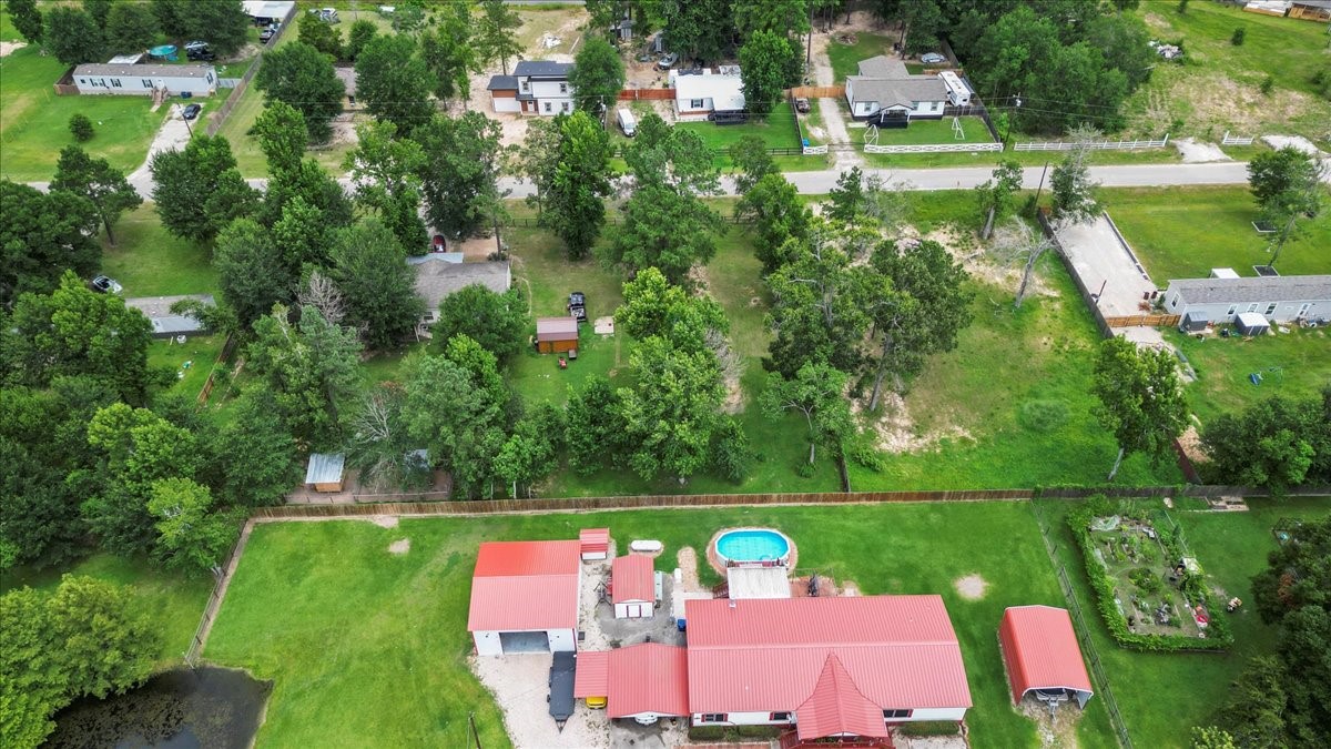 21658 County Road 3749D Cleveland, TX 77327 - Photo 20 of 26 a view of yard with swimming pool and green space