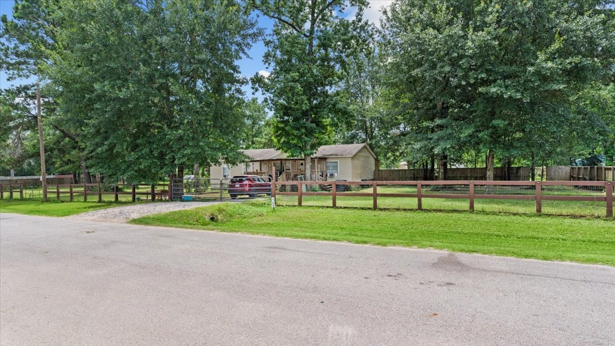 21658 County Road 3749D Cleveland, TX 77327 - Photo 2 of 26 a view of backyard with green space