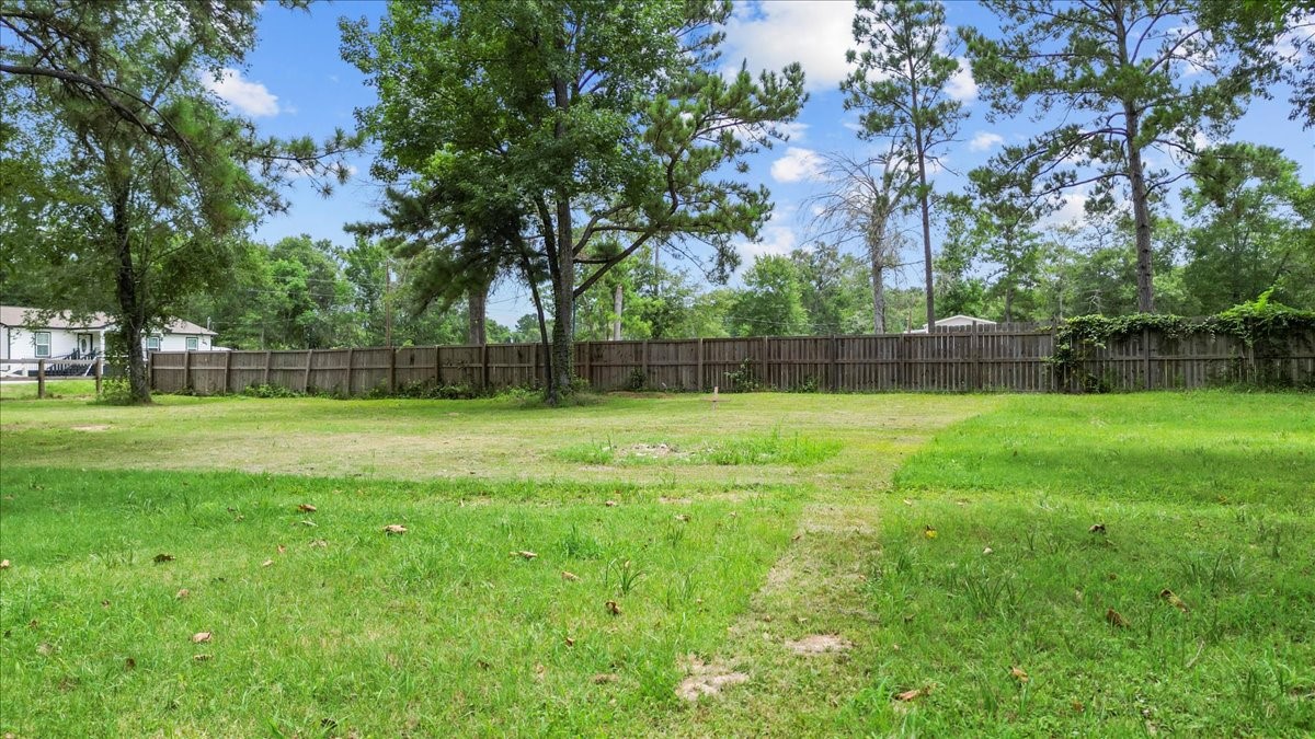 21658 County Road 3749D Cleveland, TX 77327 - Photo 8 of 26 a view of a park with large trees