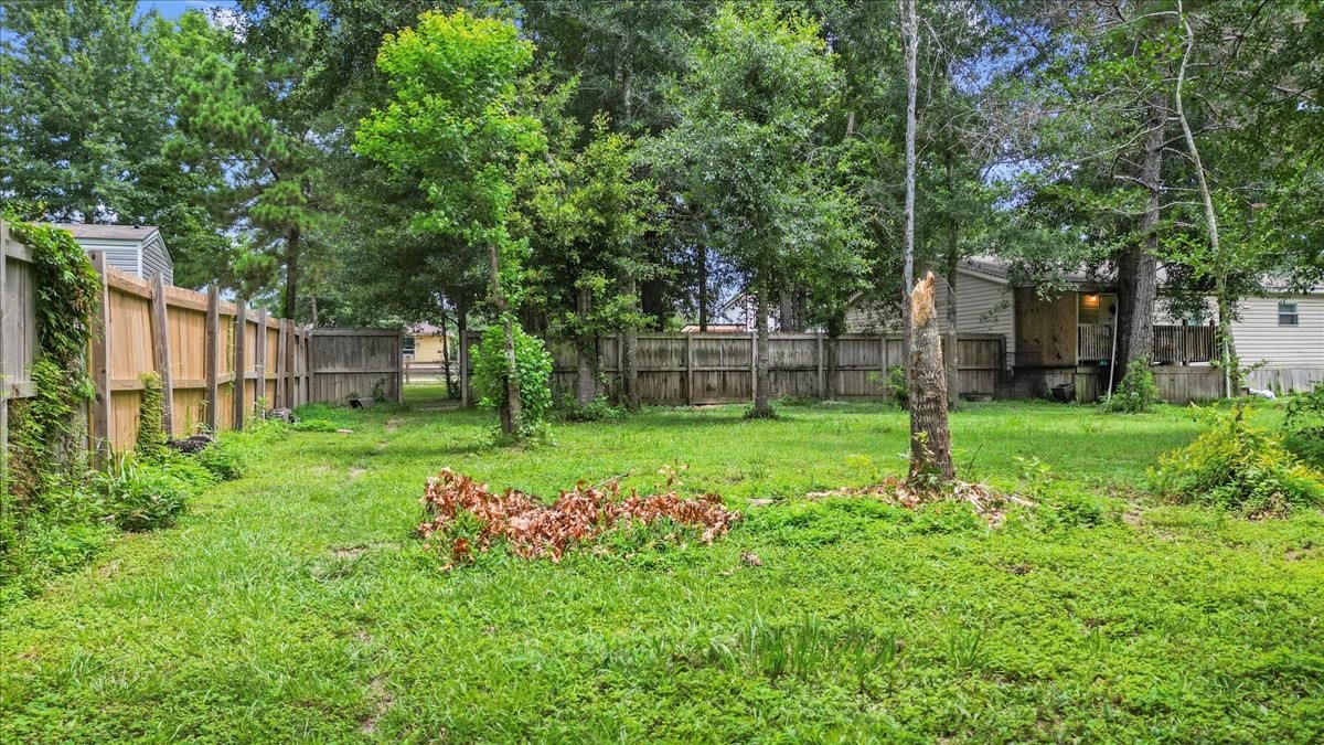21658 County Road 3749D Cleveland, TX 77327 - Photo 9 of 26 a view of a backyard with a garden
