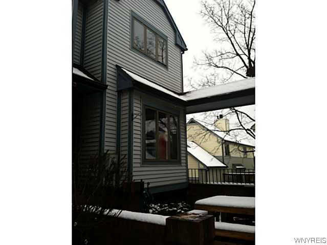 342 Frederick Douglass Street, Unit 342 Rochester, NY 14608 - Photo 1 of 1 Exterior Front. End unit with enclosed courtyard.