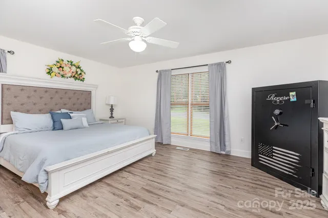 a bedroom with furniture and a window