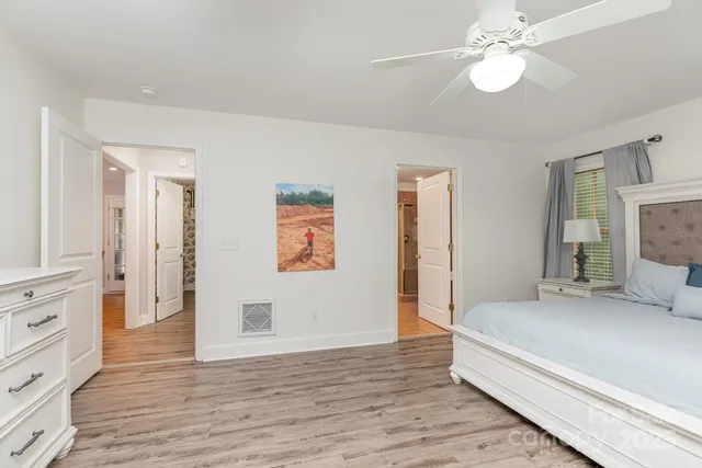 a bathroom with a sink a mirror and a vanity
