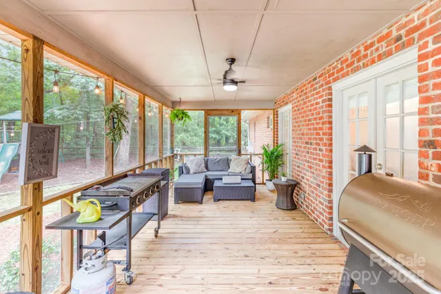 a front view of a house with a garden and yard