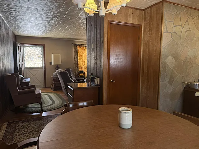 a dining room with furniture and window