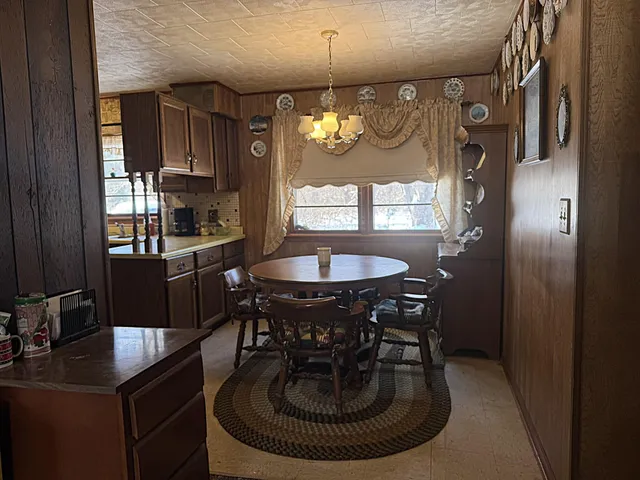 a dining room with furniture and window