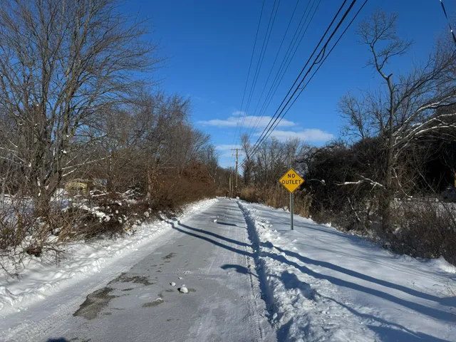a view of a road with a yard