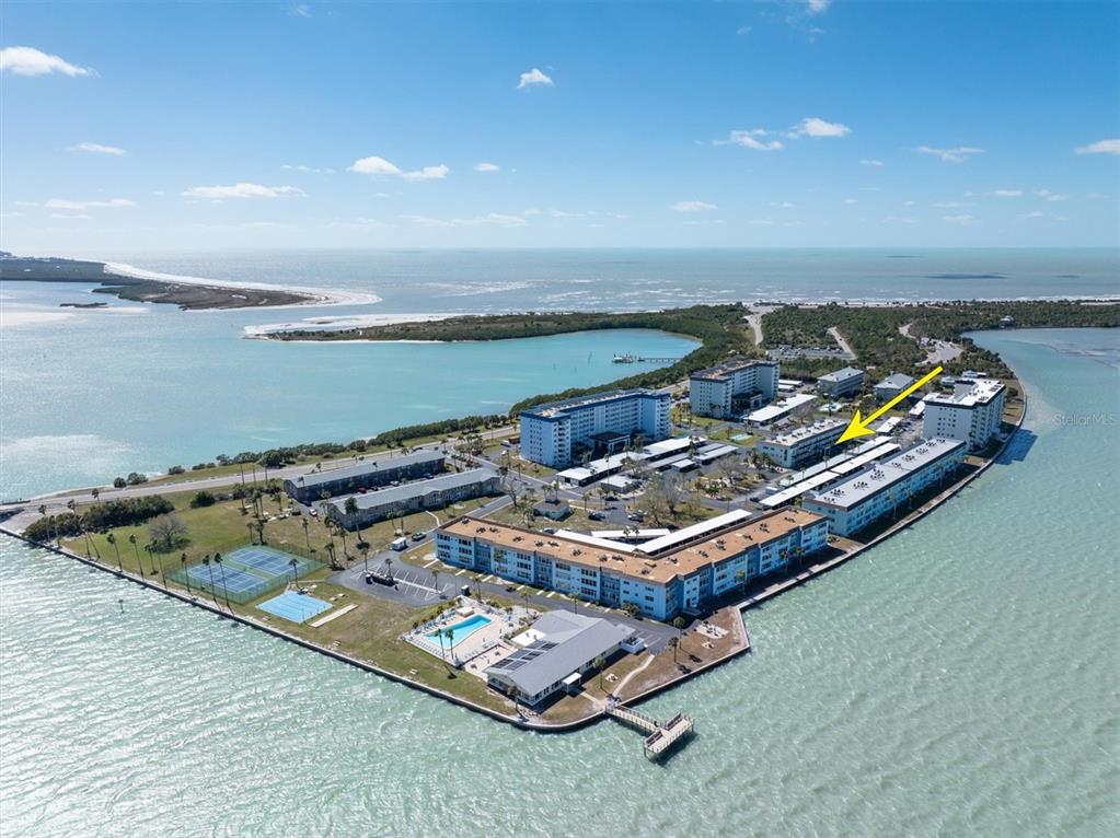 8 Glencoe Place, Unit 105 Dunedin, FL 34698 - Photo 1 of 44 an aerial view of a house with a ocean view