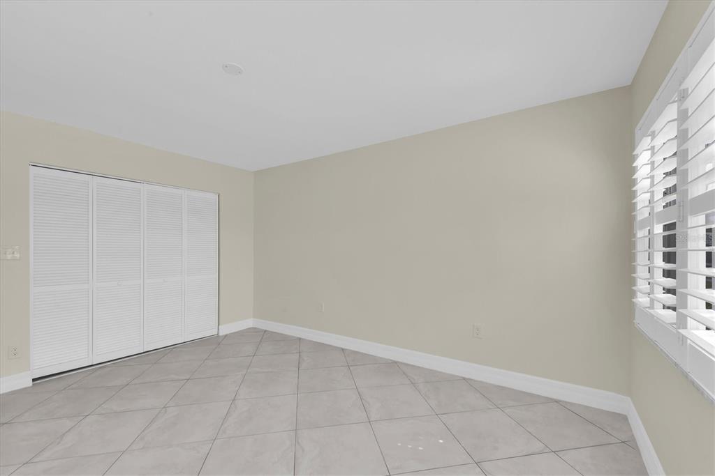 8 Glencoe Place, Unit 105 Dunedin, FL 34698 - Photo 12 of 44 a view of an empty room and window