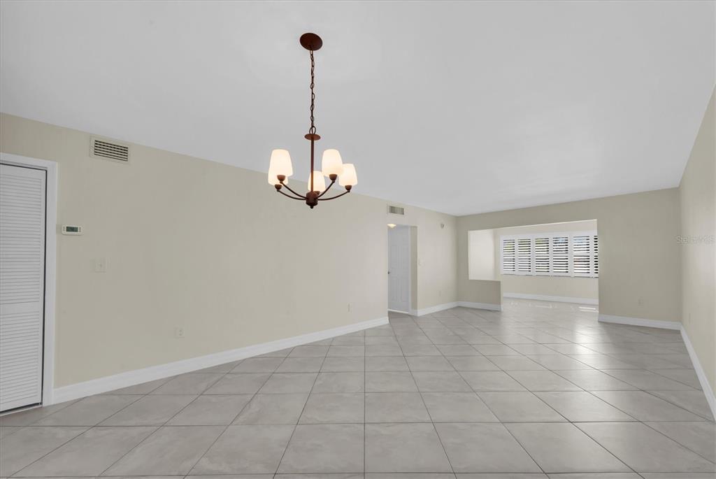 8 Glencoe Place, Unit 105 Dunedin, FL 34698 - Photo 21 of 44 a view of empty room with windows