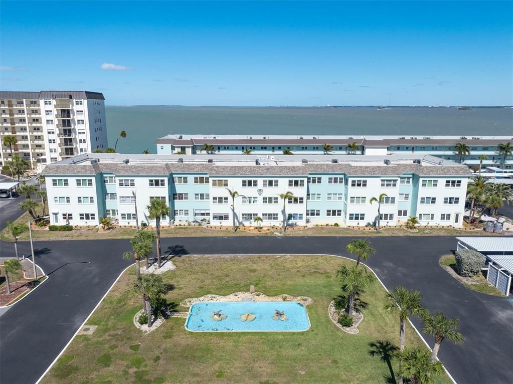 8 Glencoe Place, Unit 105 Dunedin, FL 34698 - Photo 31 of 44 swimming pool view with a outdoor seating space