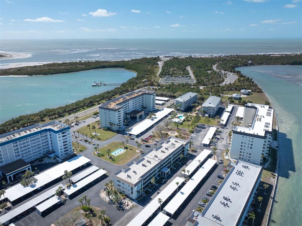 8 Glencoe Place, Unit 105 Dunedin, FL 34698 - Photo 38 of 44 an aerial view of a city with ocean view